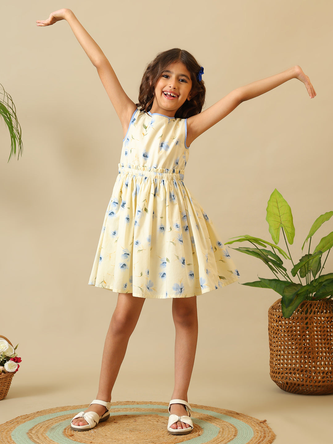Cream girls floral printed fit and flare dress with sleeveless design and gathered waist