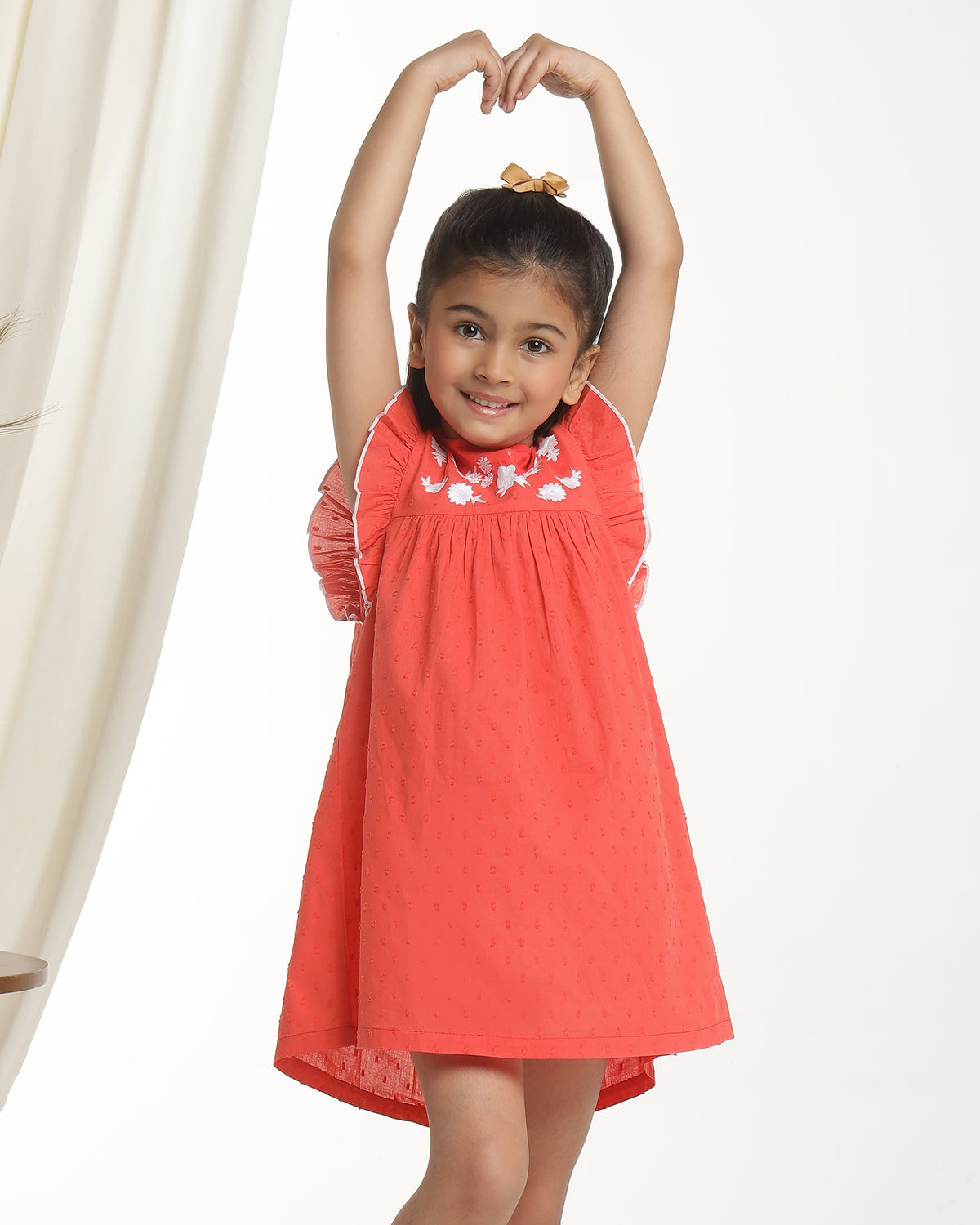 Red girls sleeveless fit and flare dress with embellished neckline and flared hem