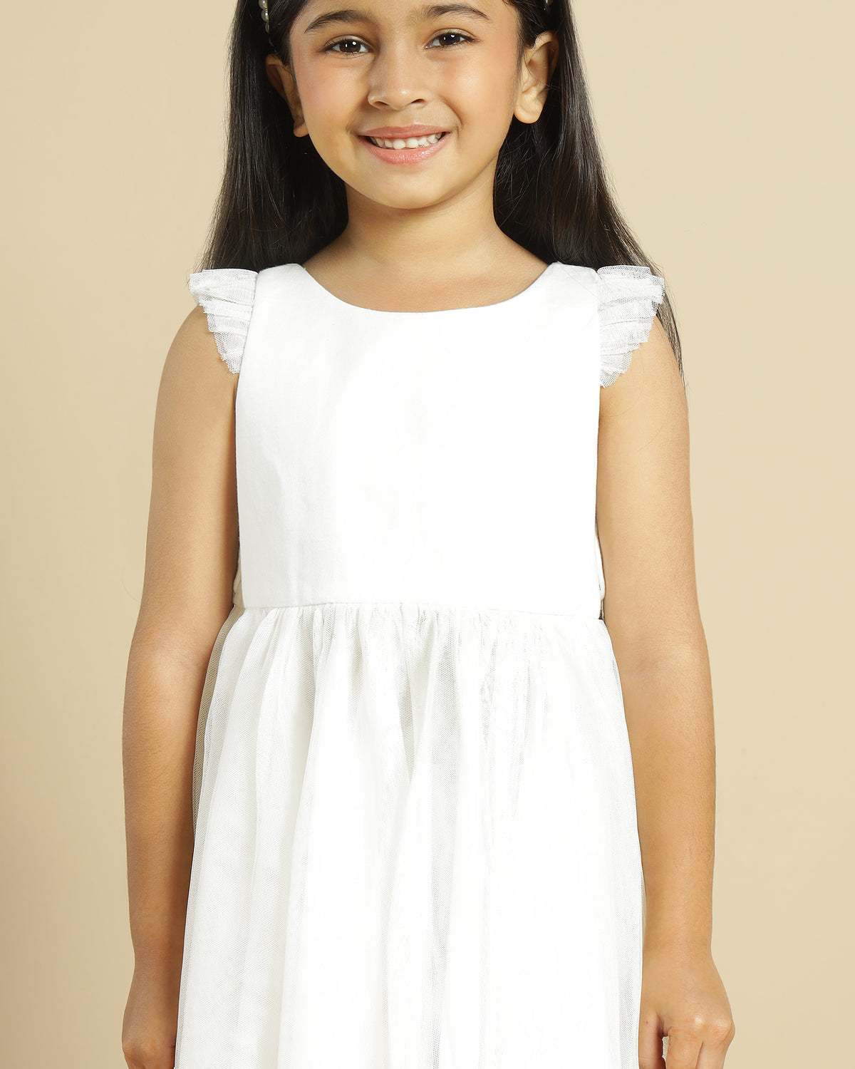 Blush pink girls layered tulle skirt with elasticated waist and flared hem
