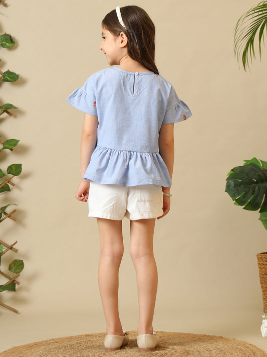 Blue girls printed short sleeve top with ruffle detailing and white shorts