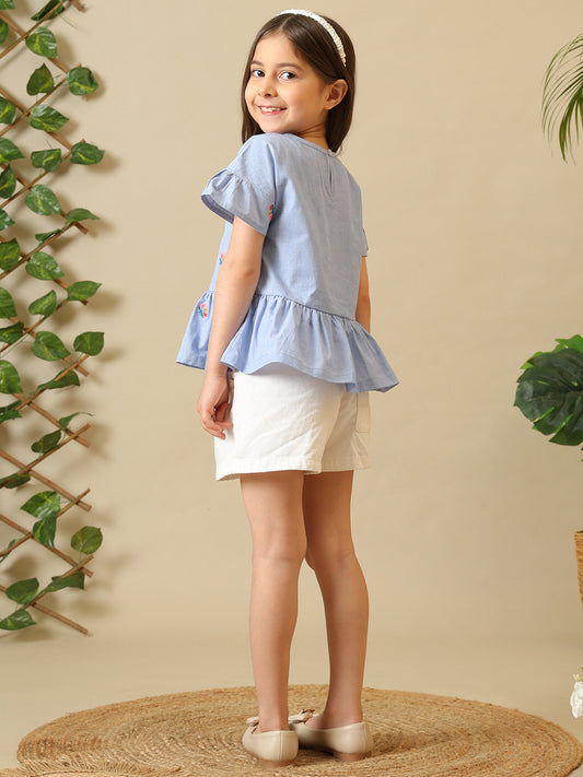 Blue girls printed short sleeve top with ruffle detailing and white shorts