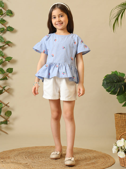 Blue girls printed short sleeve top with ruffle detailing and white shorts