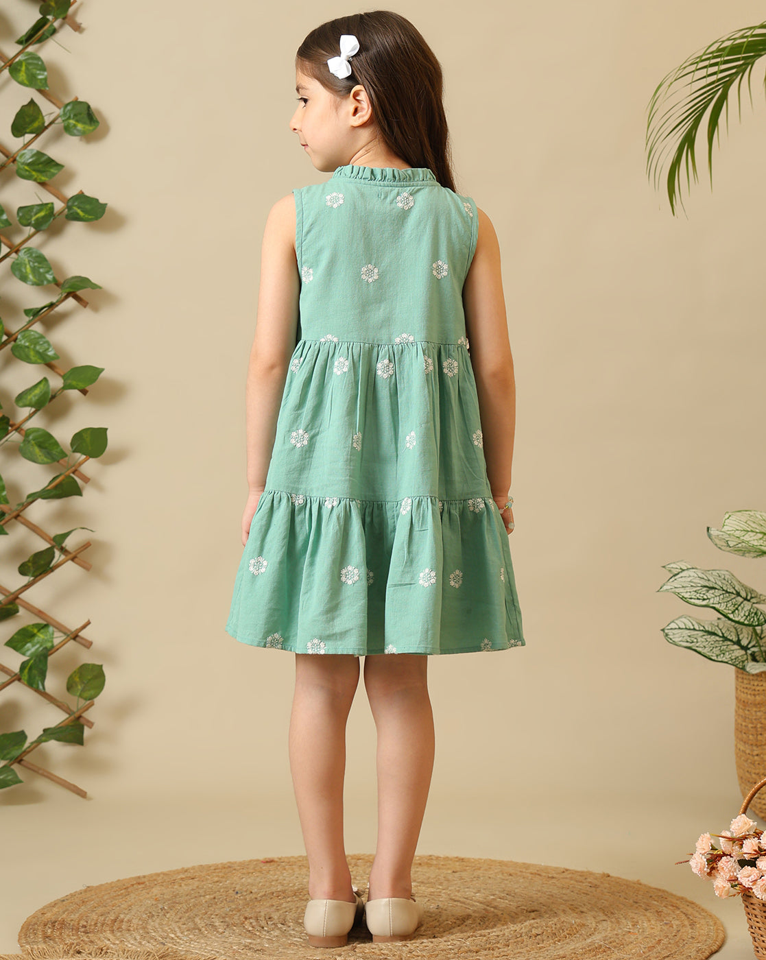 Mint green girls sleeveless A-line dress with floral embroidery and flared hem