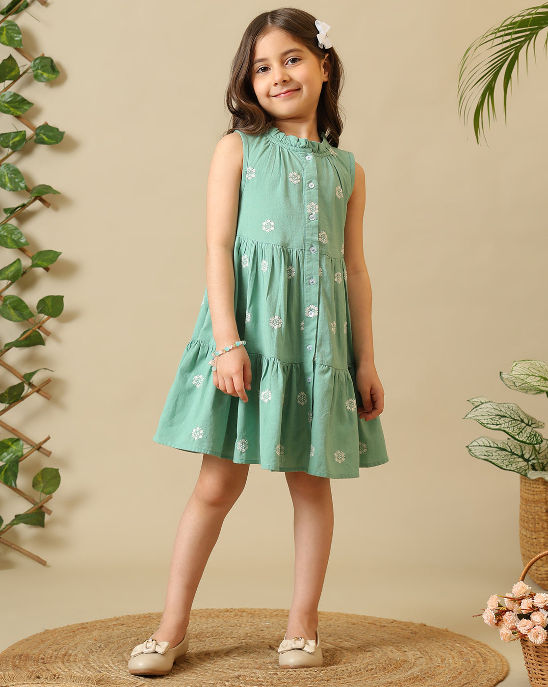 Mint green girls sleeveless A-line dress with floral embroidery and flared hem