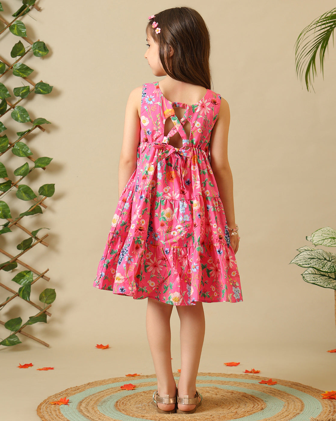 Pink floral printed girls sleeveless fit and flare dress with tiered hem
