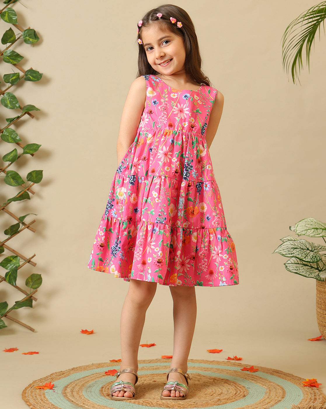 Pink floral printed girls sleeveless fit and flare dress with tiered hem