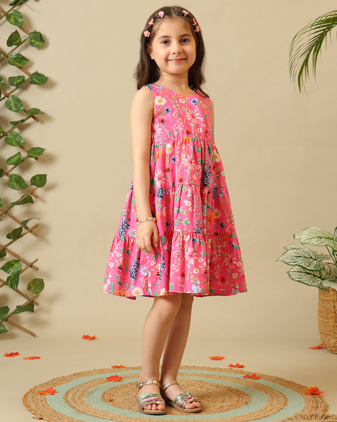 Pink floral printed girls sleeveless fit and flare dress with tiered hem