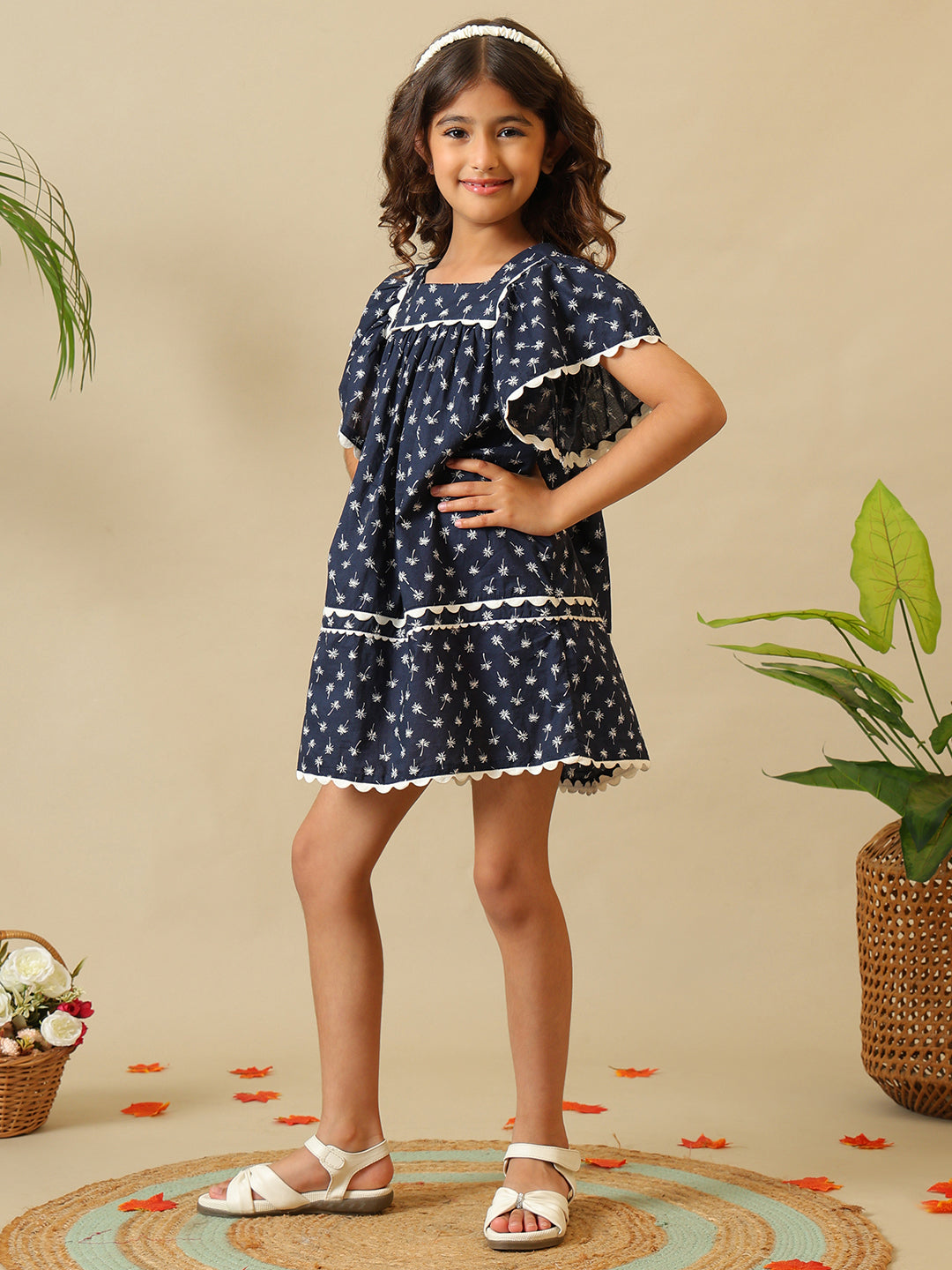 Navy blue girls floral printed dress with ruffle sleeves, gathered waist and contrast trim