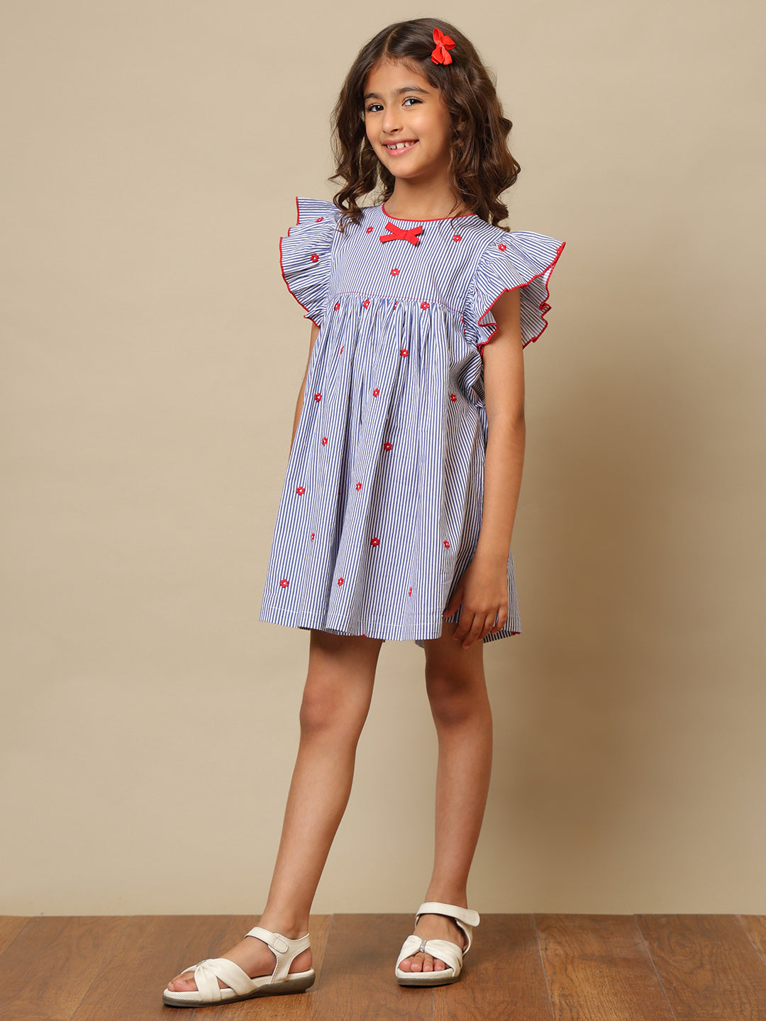Blue striped girls printed dress with ruffle sleeves, gathered waist and red bow detailing