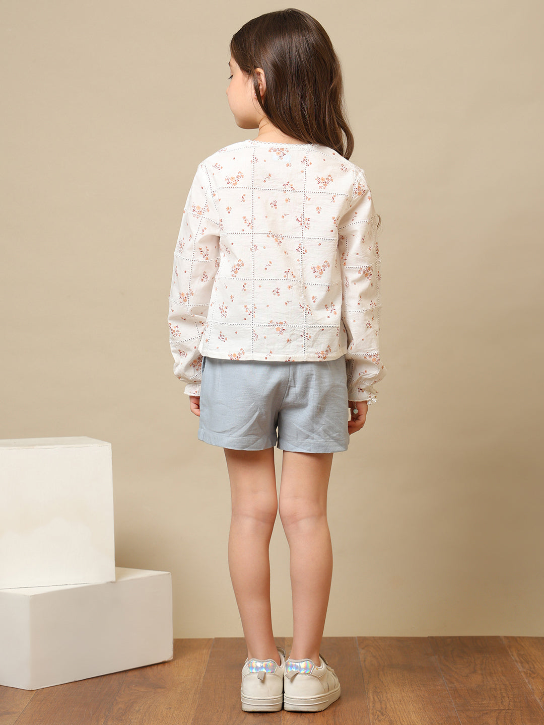 White girls floral embroidered long sleeve top with ruffle detailing and blue shorts