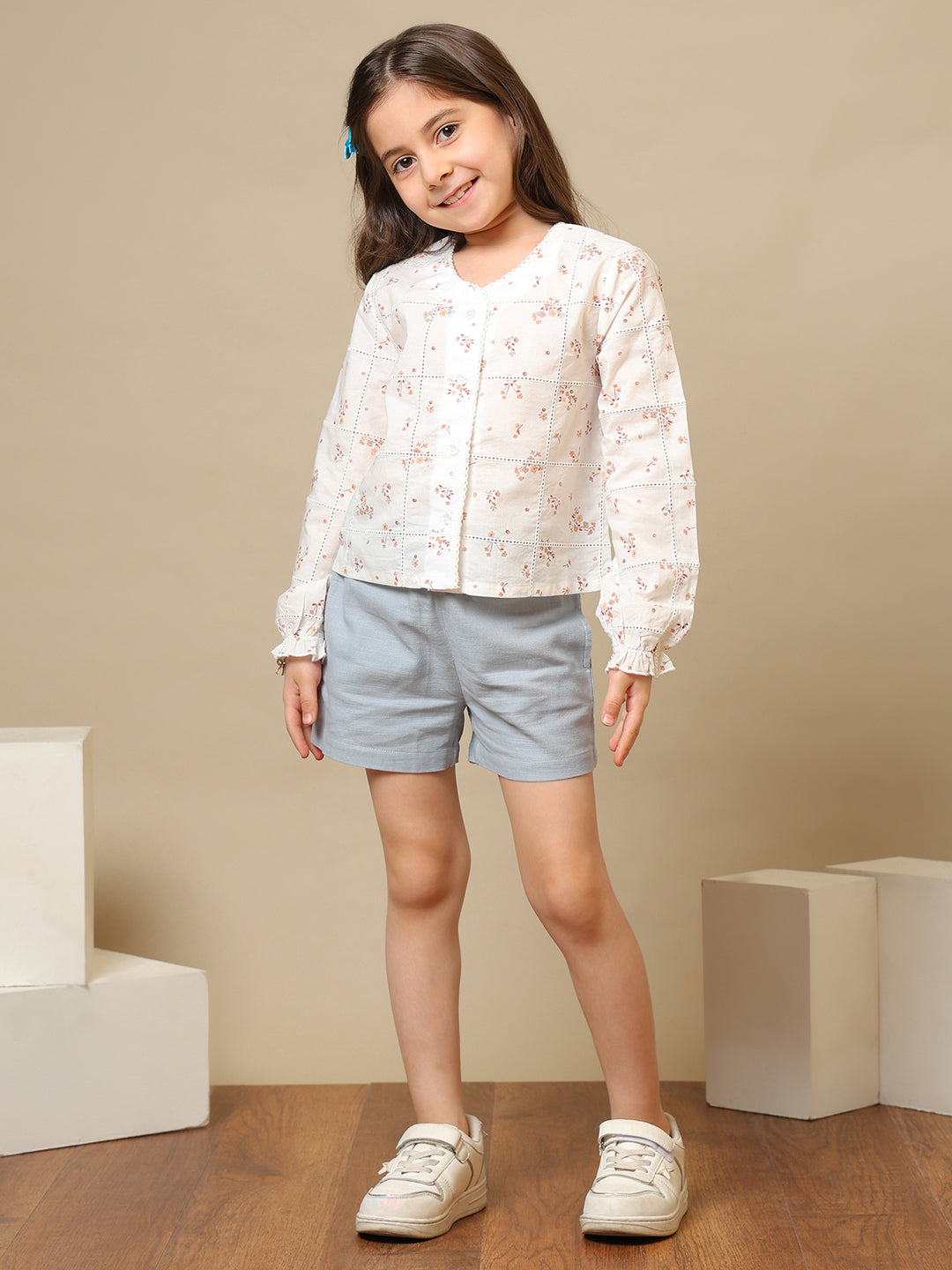 White girls floral embroidered long sleeve top with ruffle detailing and blue shorts