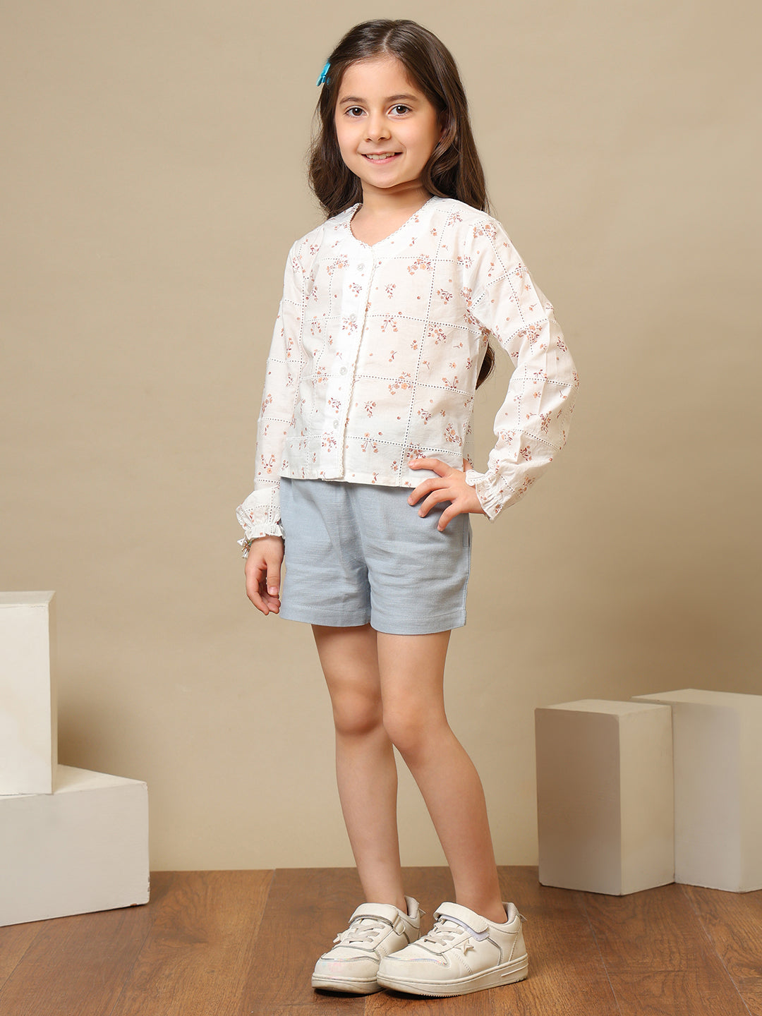 White girls floral embroidered long sleeve top with ruffle detailing and blue shorts
