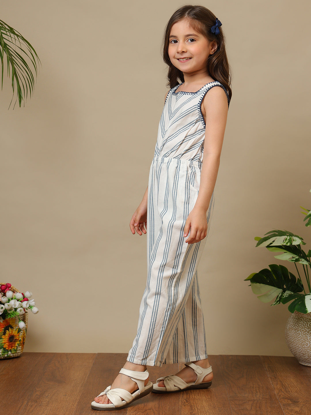Blue and white striped girls sleeveless jumpsuit with wide-leg pants and chevron pattern