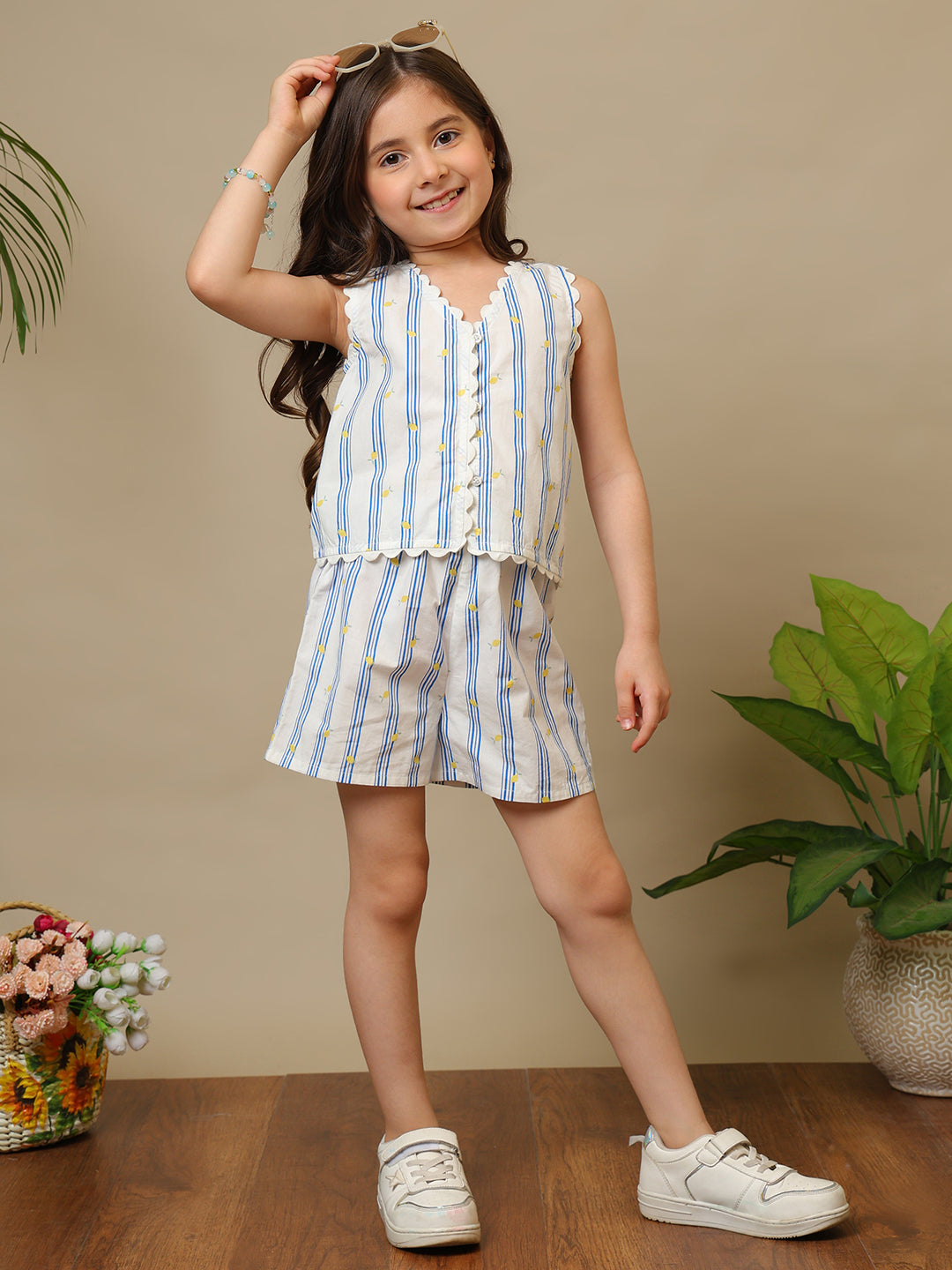 Blue and white striped girls sleeveless co-ord set with ruffle top and matching shorts