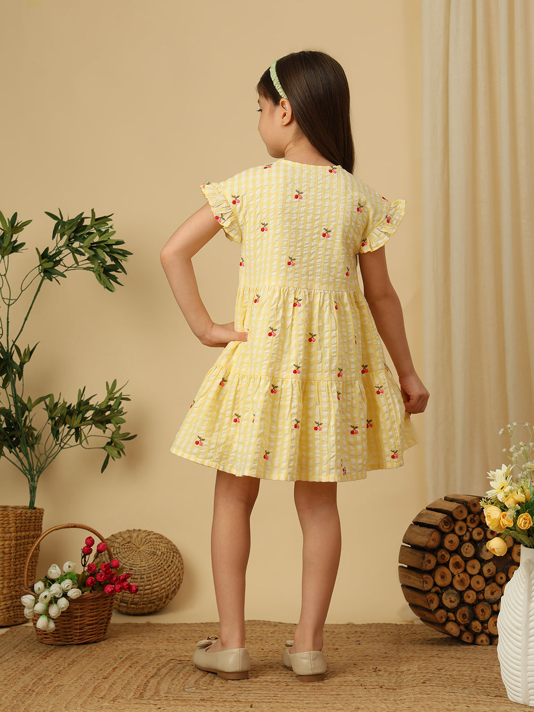Girls pink gingham checked dress with all-over cherry print, ruffle sleeves and gathered flared silhouette
