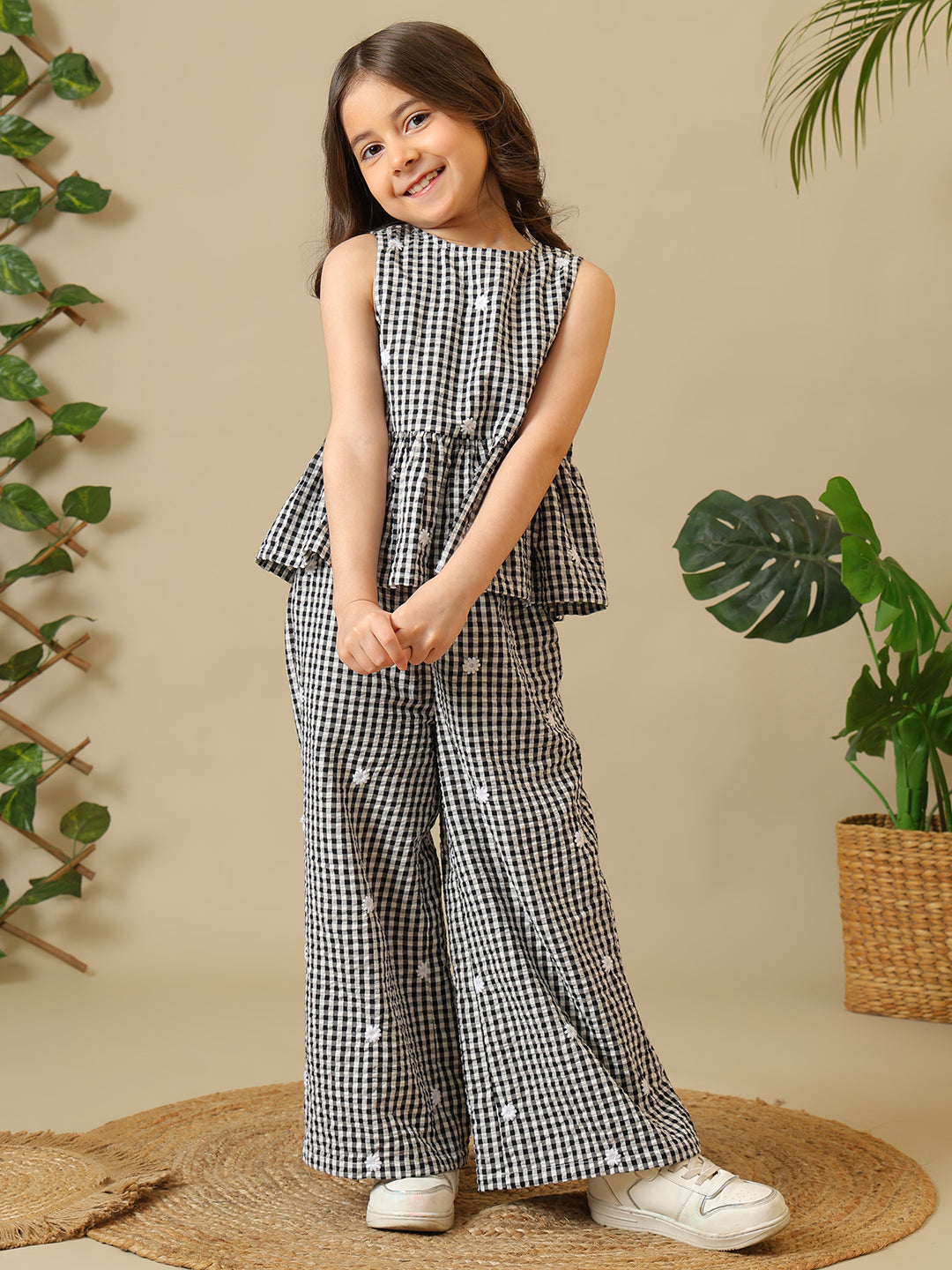 Black and white gingham girls co-ord set with sleeveless peplum top and wide-leg pants