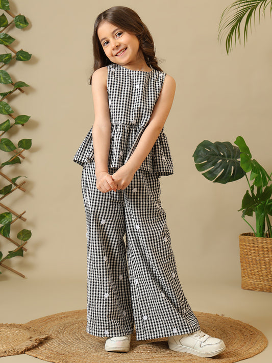 Black and white gingham girls co-ord set with sleeveless peplum top and wide-leg pants