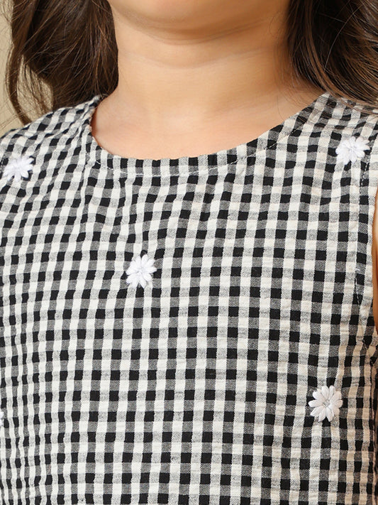 Black and white gingham girls co-ord set with sleeveless peplum top and wide-leg pants