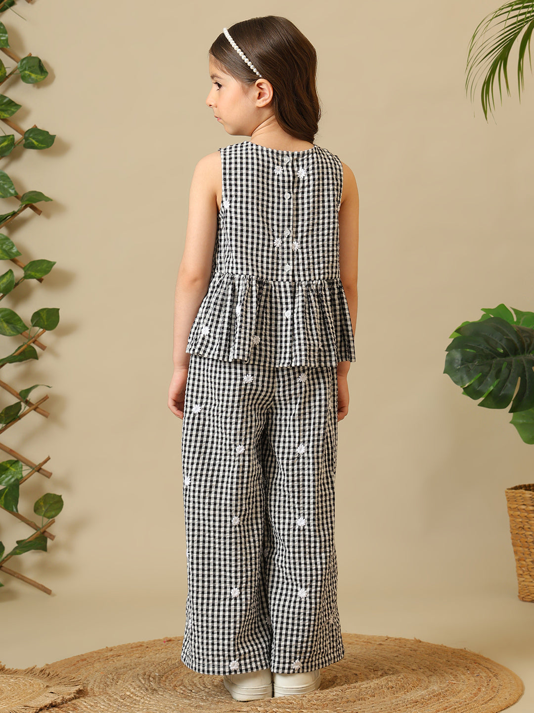 Black and white gingham girls co-ord set with sleeveless peplum top and wide-leg pants