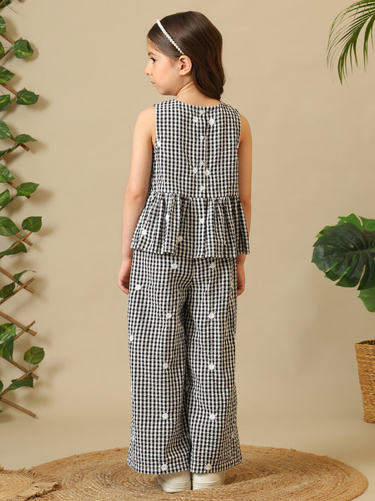 Black and white gingham girls co-ord set with sleeveless peplum top and wide-leg pants