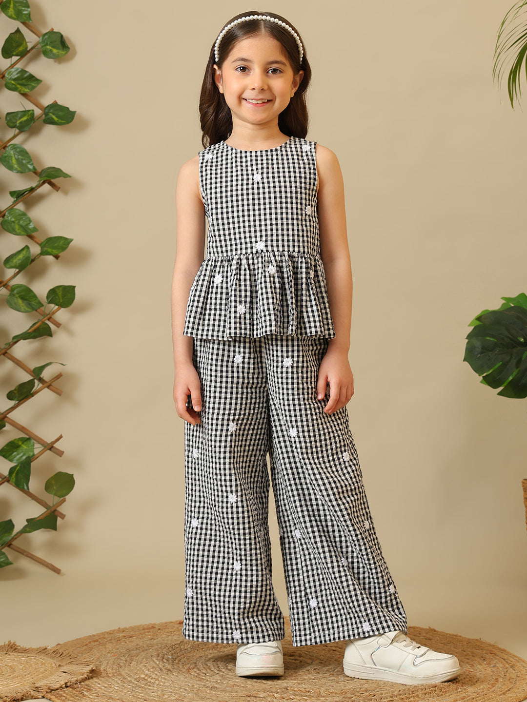 Black and white gingham girls co-ord set with sleeveless peplum top and wide-leg pants