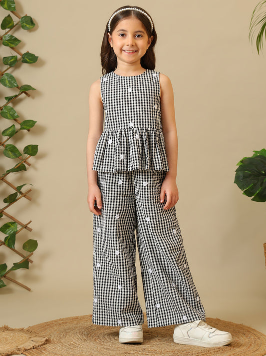 Black and white gingham girls co-ord set with sleeveless peplum top and wide-leg pants