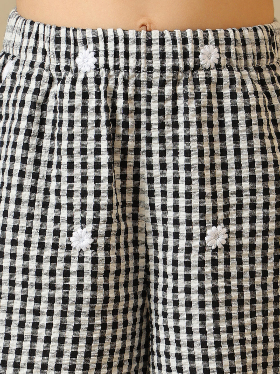 Black and white gingham girls co-ord set with sleeveless peplum top and wide-leg pants