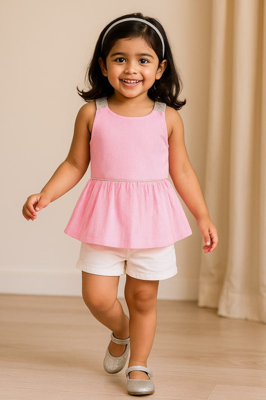 Pink girls sleeveless co-ord set with textured top and matching flared skirt