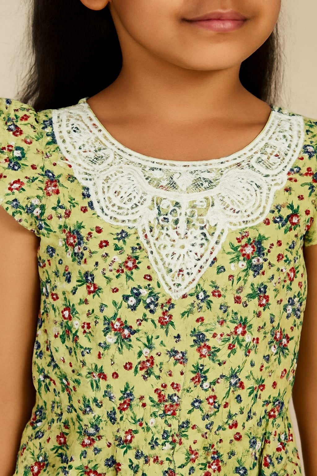Green floral printed girls short sleeve peplum top with ruffle detailing and flared hem