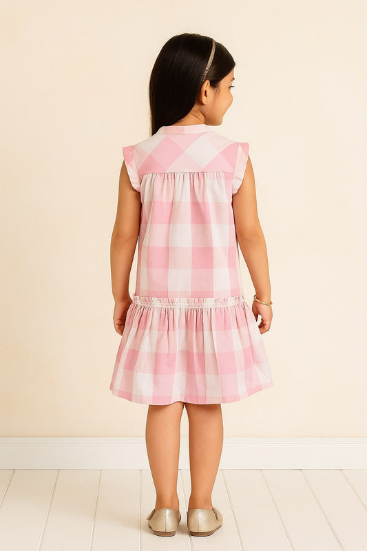 Pink and white checked girls sleeveless A-line dress with ruffle detailing and flared hem