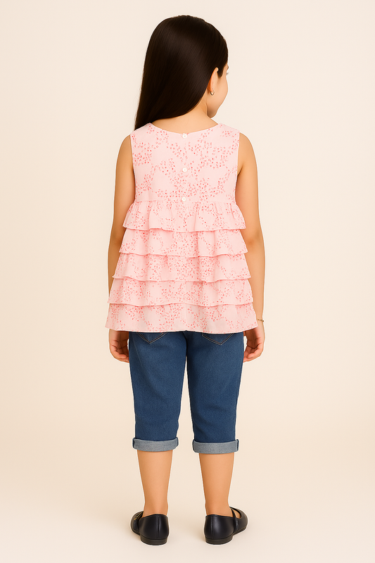 Light pink girls sleeveless layered ruffle dress with floral print and flared hem