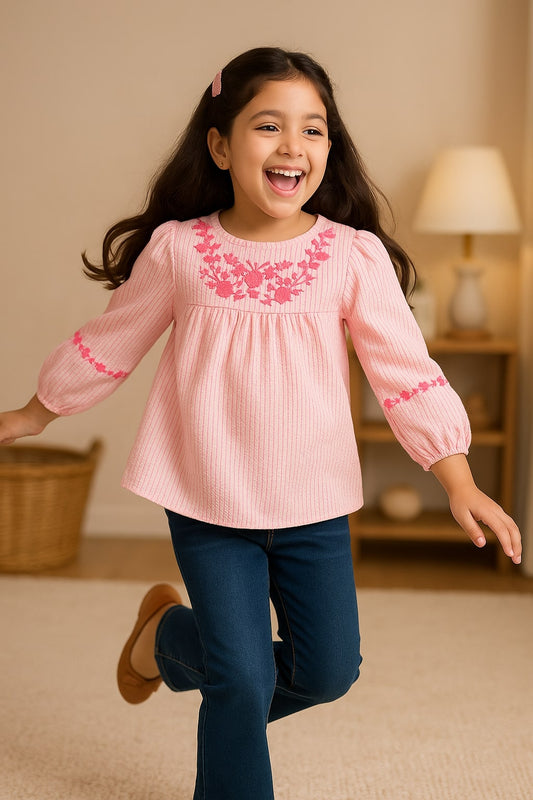Pink girls short sleeve top with ruffle neckline and gathered sleeve detailing