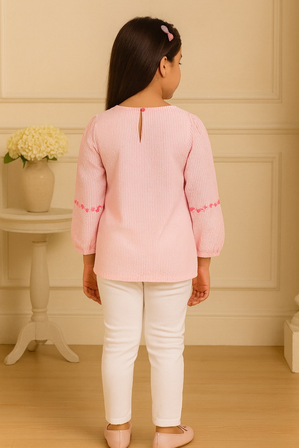 Pink girls short sleeve top with ruffle neckline and gathered sleeve detailing