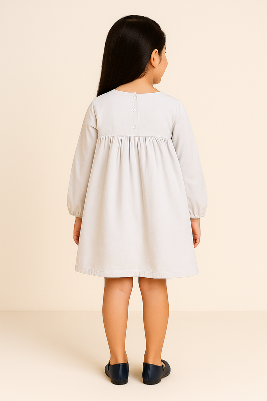 White girls long sleeve dress with colourful embroidered detailing and gathered waist