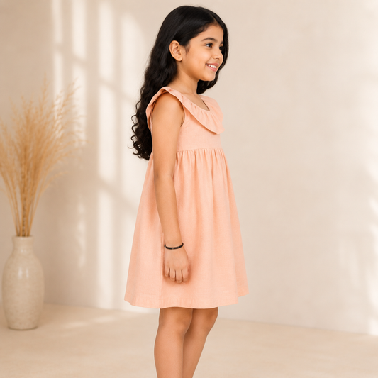 Peach girls long sleeve A-line dress with ruffle detailing and flared hem