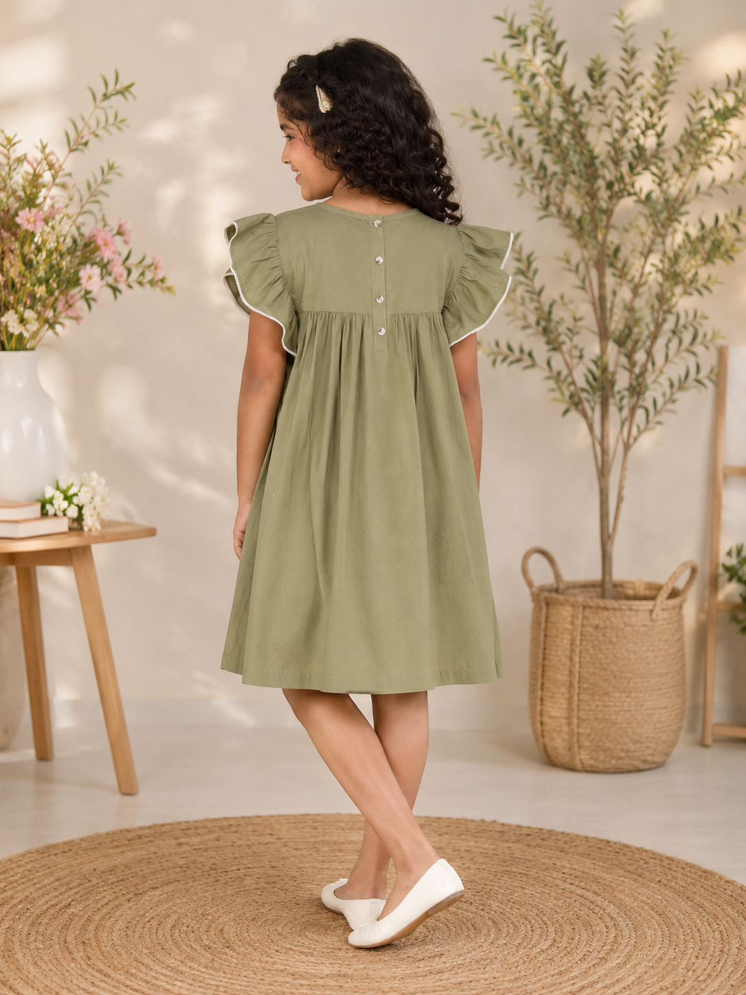 Olive green girls sleeveless fit and flare dress with ruffle detailing and flared hem