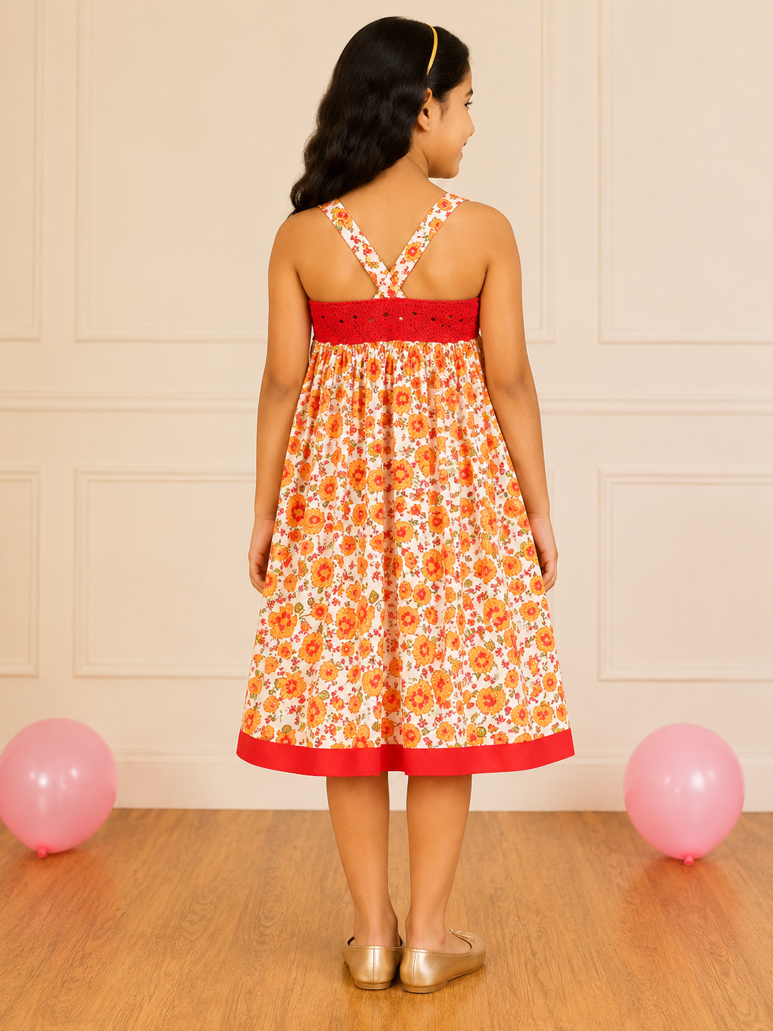White and orange floral printed girls sleeveless dress with contrast red hem and flared skirt