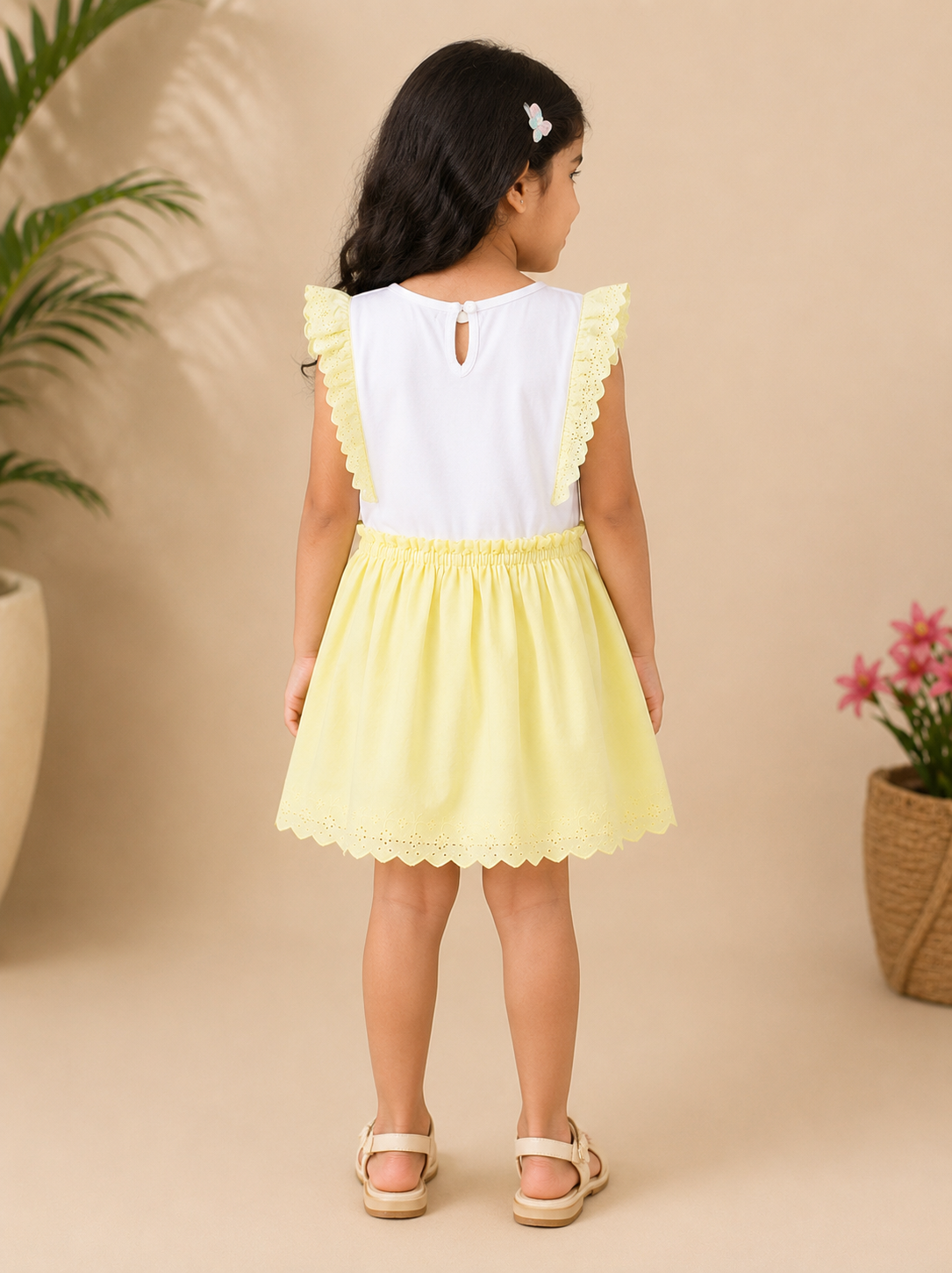 White girls sleeveless top with yellow striped skirt and gathered waist