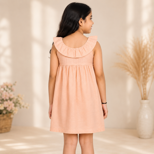 Peach girls long sleeve A-line dress with ruffle detailing and flared hem