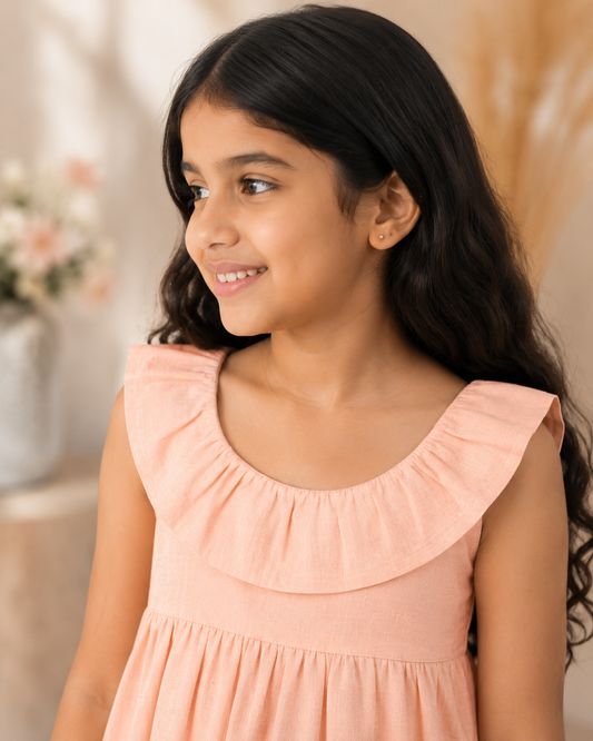 Peach girls long sleeve A-line dress with ruffle detailing and flared hem