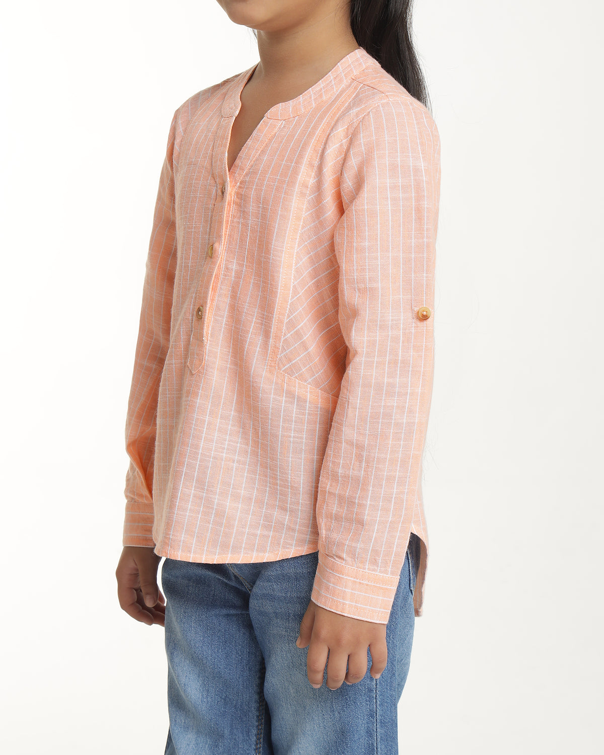 Peach girls long sleeve top with ruffle detailing and round neckline