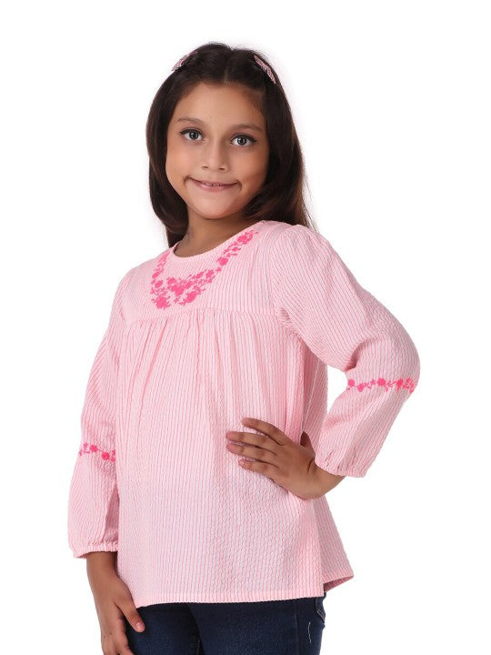 Pink girls short sleeve top with ruffle neckline and gathered sleeve detailing