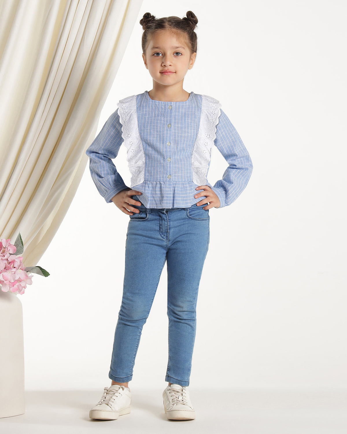 Blue and white striped girls long sleeve top with ruffle front detailing