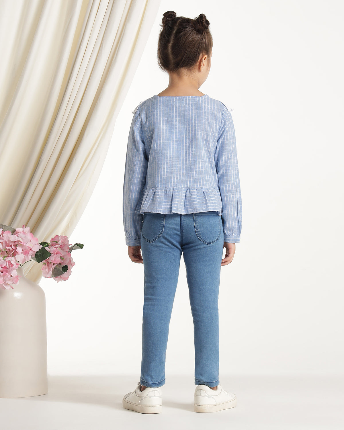 Blue and white striped girls long sleeve top with ruffle front detailing
