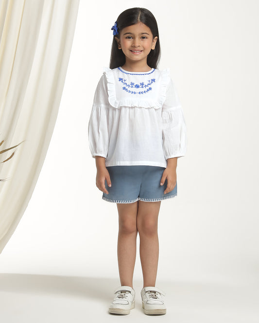 White girls long sleeve top with navy heart print and contrast trim