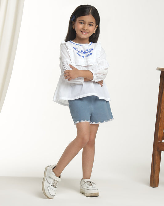 White girls long sleeve top with navy heart print and contrast trim