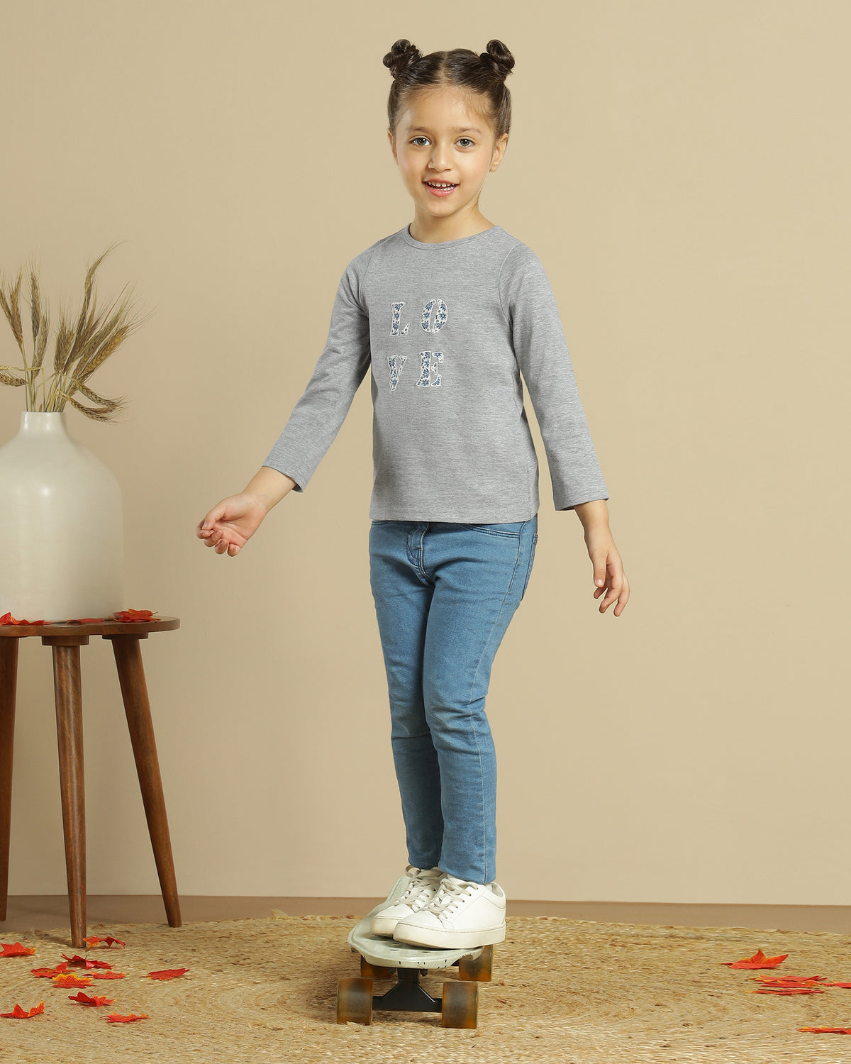 Brown girls wide-leg pants with elasticated waist and relaxed fit