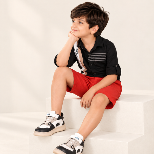 Red boys casual shorts with elasticated waist and knee-length fit
