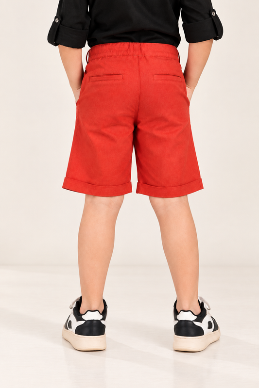 Red boys casual shorts with elasticated waist and knee-length fit
