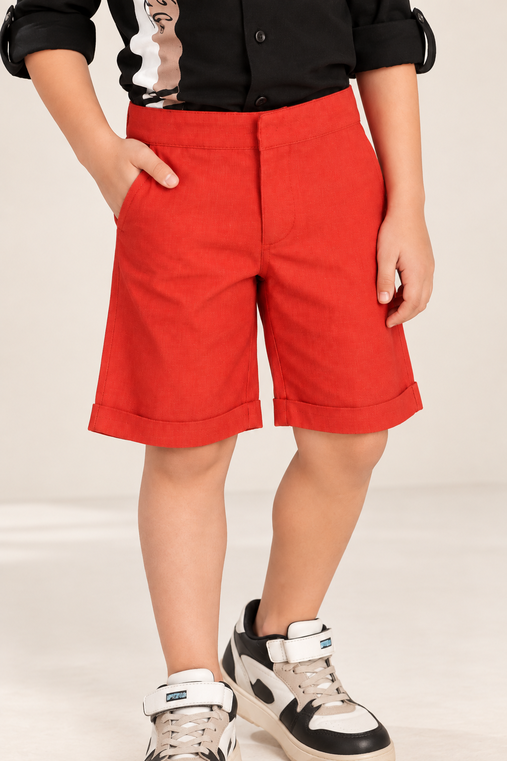 Red boys casual shorts with elasticated waist and knee-length fit
